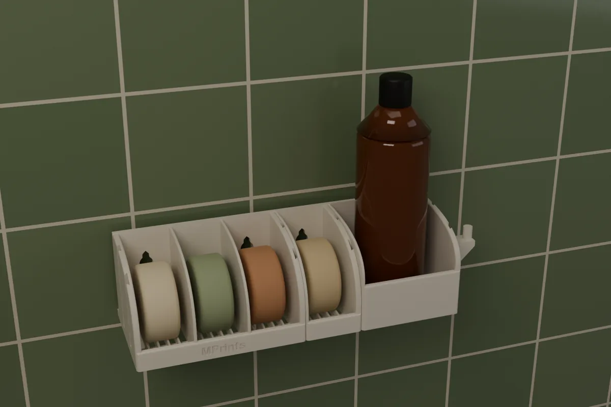 A full set on a tiled wall: the 3-Box Soap Holder with a 1-Box Add-On, a Bottle Holder with a bottle, and a Loofah Hook.